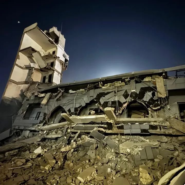 The mayor and city council members inspect the attack site in Sidon at night