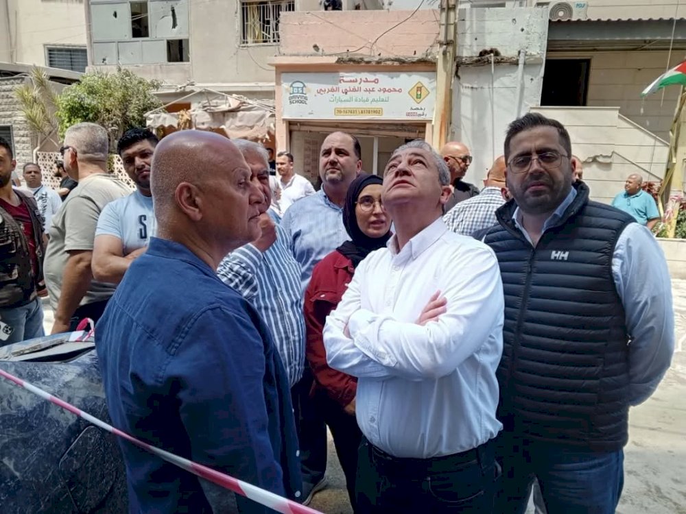 Mostapha Hijazi and Abu Zeid inspect the site of the Israeli aggression in Al-Qaya'ah.